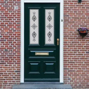 A traditional frosted Victorian door window film with an ornate design