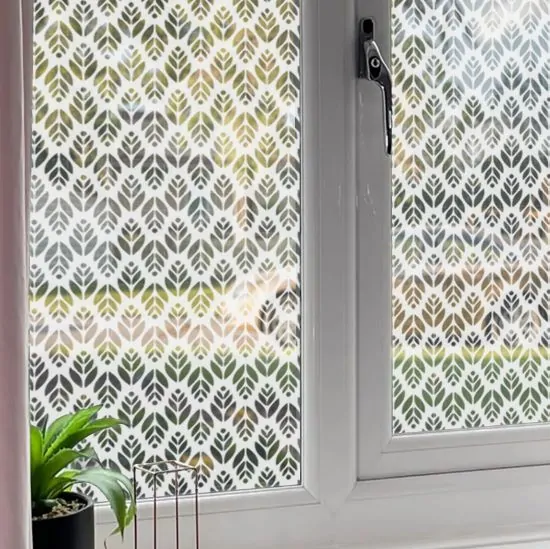 Leaf patterned window film installed into a front room for home privacy