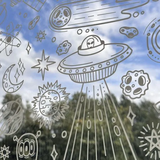 A close up of our ultra clear window film with doodle patterns on.
